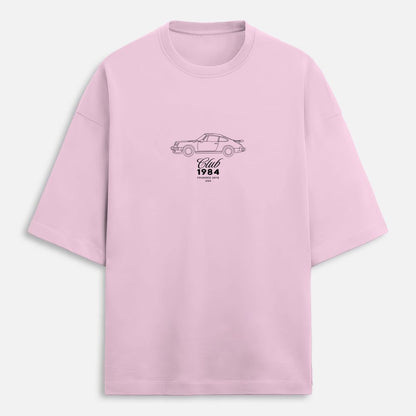 Pink t-shirt with a car graphic and text on a white background