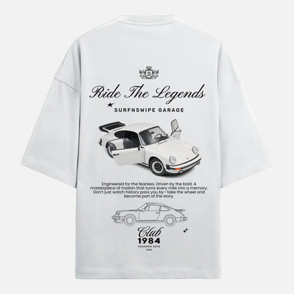 White t-shirt with car graphic and text on a white background