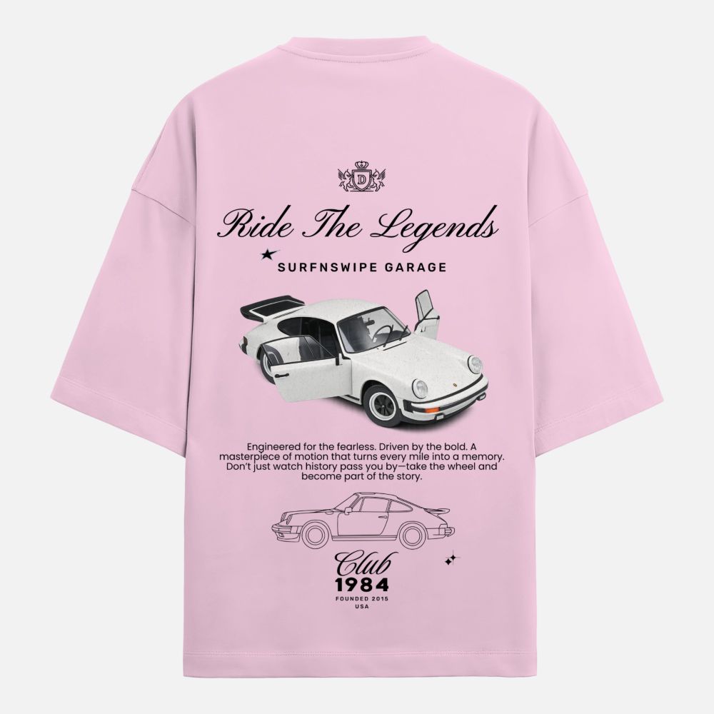 Pink t-shirt with car graphics and text on a white background