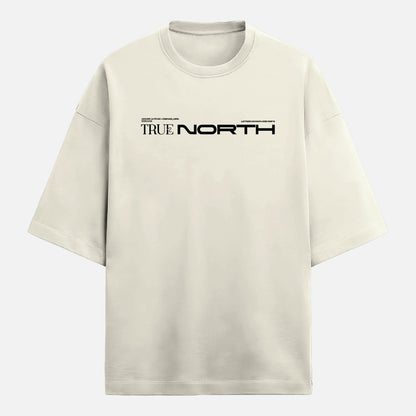 Beige t-shirt with 'TRUE NORTH' text on a light gray background