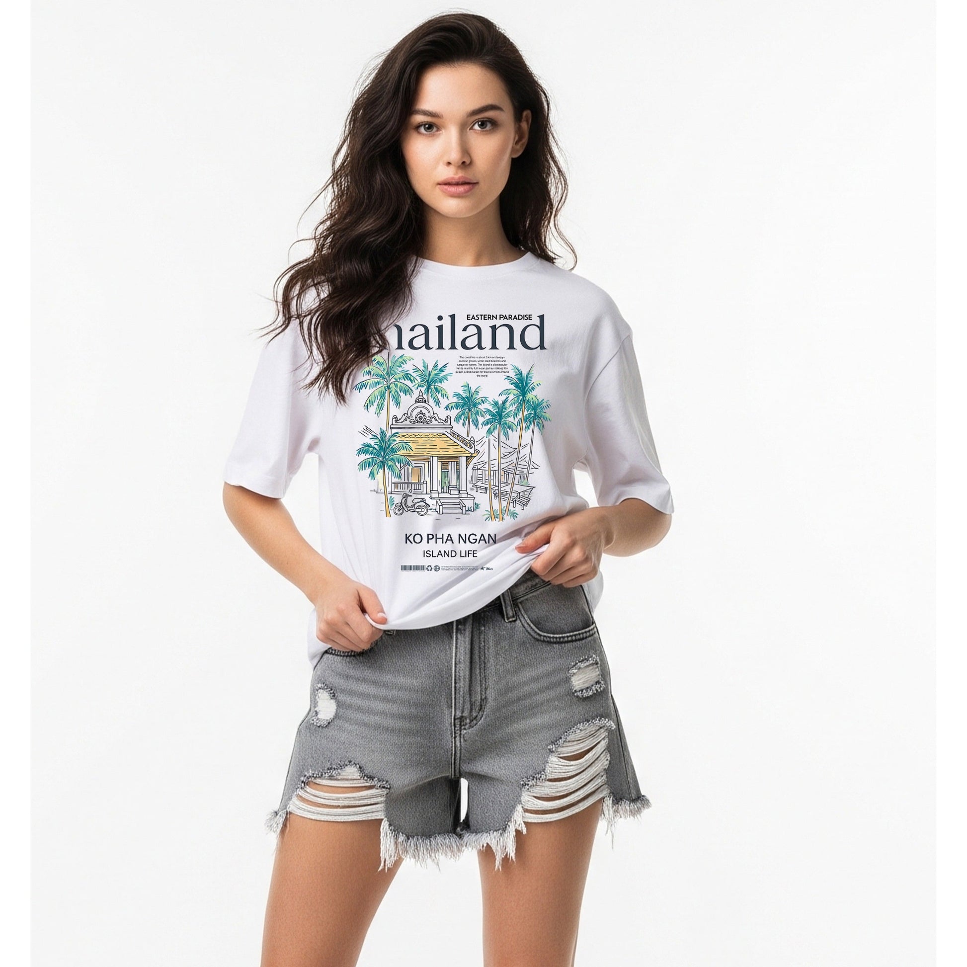 Woman wearing a white t-shirt with a graphic design and ripped denim shorts on a white background