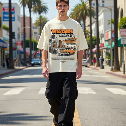 Person wearing a 'Westside Hustle City' t-shirt on a city street.