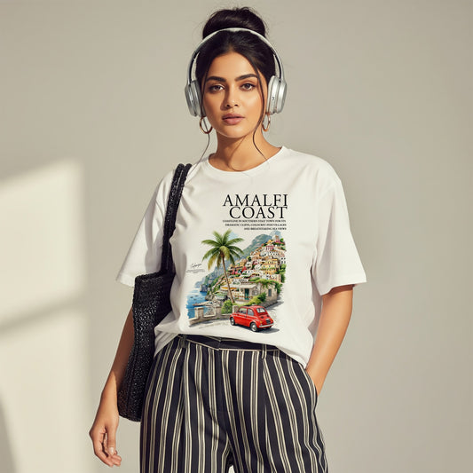 Woman wearing a white t-shirt with a graphic design and headphones, standing against a plain background.
