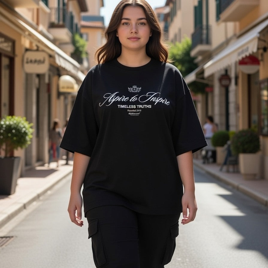 Person wearing a black t-shirt with text on a street