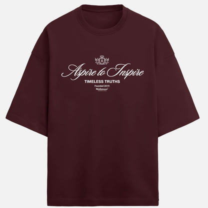 Maroon t-shirt with 'Aspire to Inspire' text on a white background