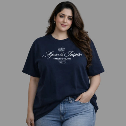 Woman wearing a navy blue t-shirt with text on a gray background