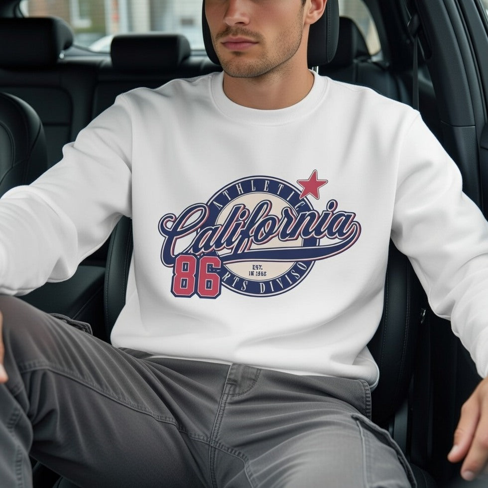 Person wearing a white sweatshirt with 'California 86' design sitting in a car.