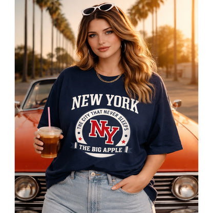 Woman wearing a navy blue 'New York' t-shirt in front of an orange car with palm trees in the background.