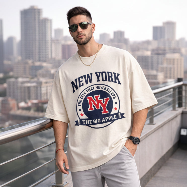 Man wearing a 'New York' t-shirt with a cityscape background