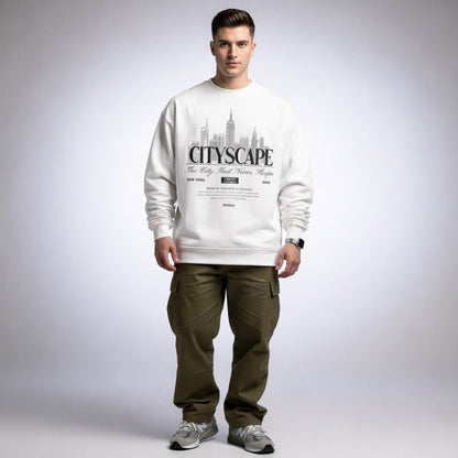 Man wearing a white sweatshirt with 'CITYSCAPE' design on a plain background