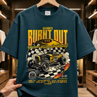 Close-up of SURFNSWIPE Burnt Out Hot Rod oversized T-shirt in Petrol Blue with yellow racing graphic, checkered flag, and 'Ultimate Burnt Out' print