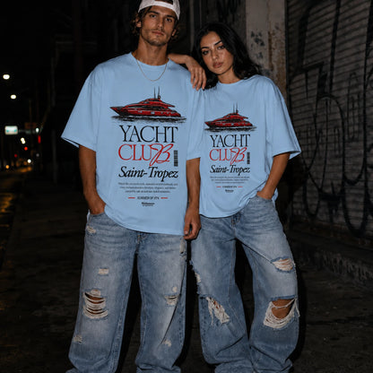 Couple wearing blue Yacht Club Saint-Tropez oversized tee with ripped denim jeans