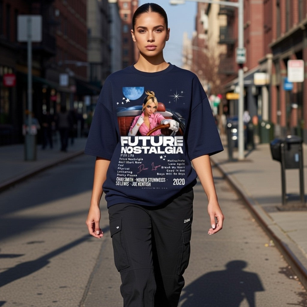 Person wearing a navy blue t-shirt with graphic design and text on a city street.