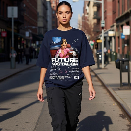 Person wearing a navy blue t-shirt with graphic design and text on a city street.