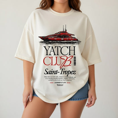 Person wearing a white t-shirt with 'Yatch Club Saint-Tropez' design.