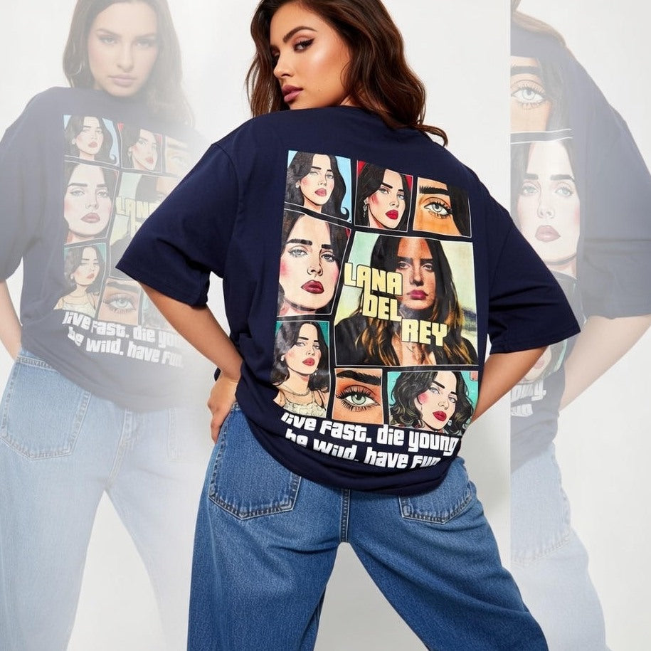 Person wearing a navy blue t-shirt with graphic designs and text, standing against a white background.