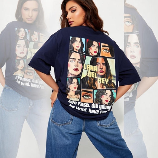 Person wearing a navy blue t-shirt with graphic designs and text, standing against a white background.