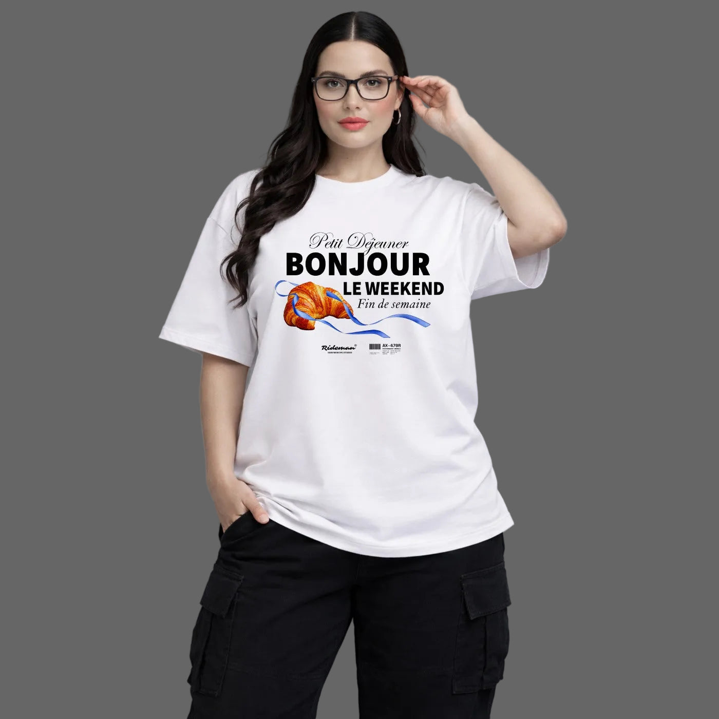 Woman wearing a white t-shirt with text and graphics on a gray background