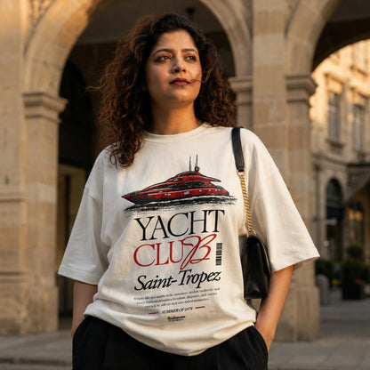 Woman wearing off-white Yacht Club Saint-Tropez oversized tee with black baggy trouser.
