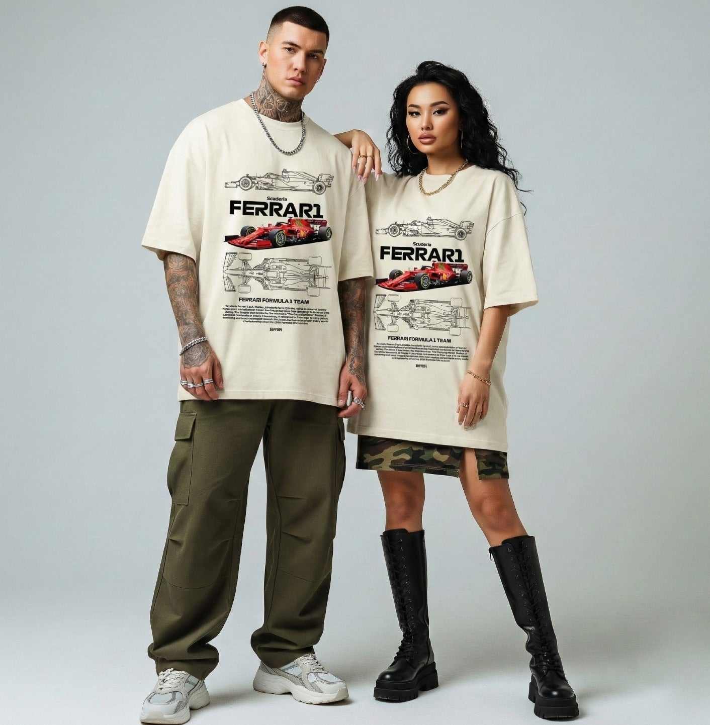 Two people wearing matching t-shirts with Ferrari graphics on a plain background
