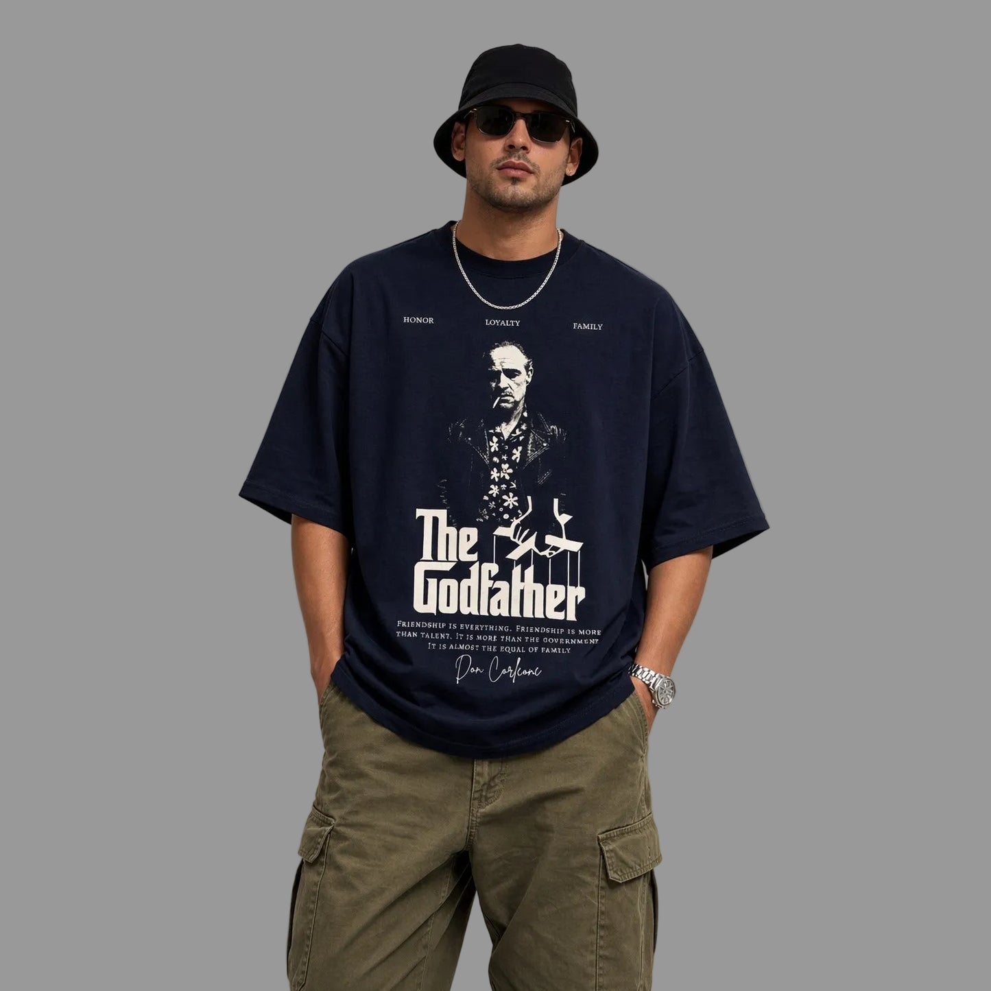 Man wearing a navy 'The Godfather' t-shirt with a plain background