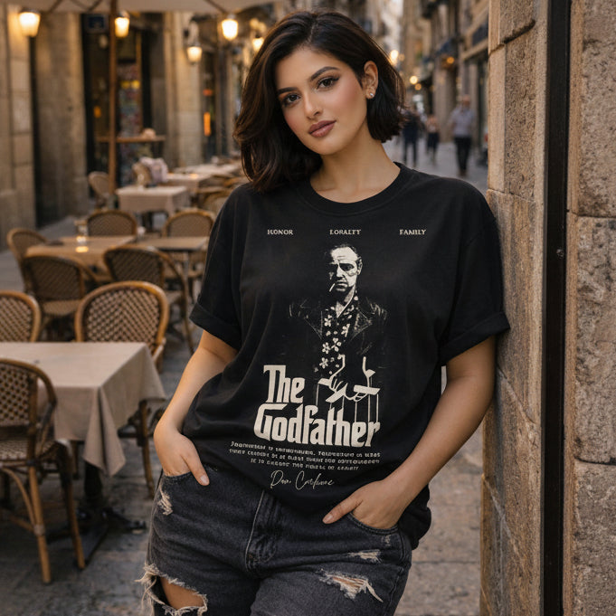 Woman wearing a black 'The Godfather' t-shirt in an outdoor setting