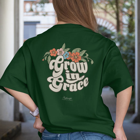 Person wearing a green t-shirt with 'Grow in Grace' design on the back.