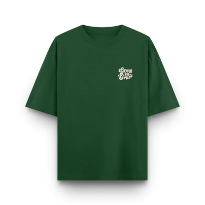 Green t-shirt with white text  Grow in Grace on a white background
