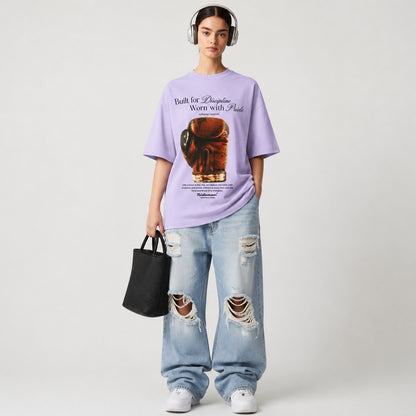 Woman wearing lavender Heritage Boxing Glove tee and baggy jean
