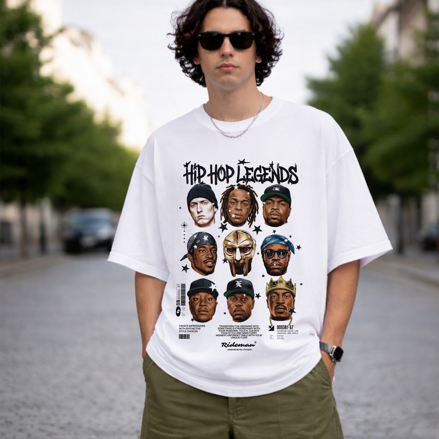 Person wearing a white t-shirt with 'Hip Hop Legends' graphic design outdoors.