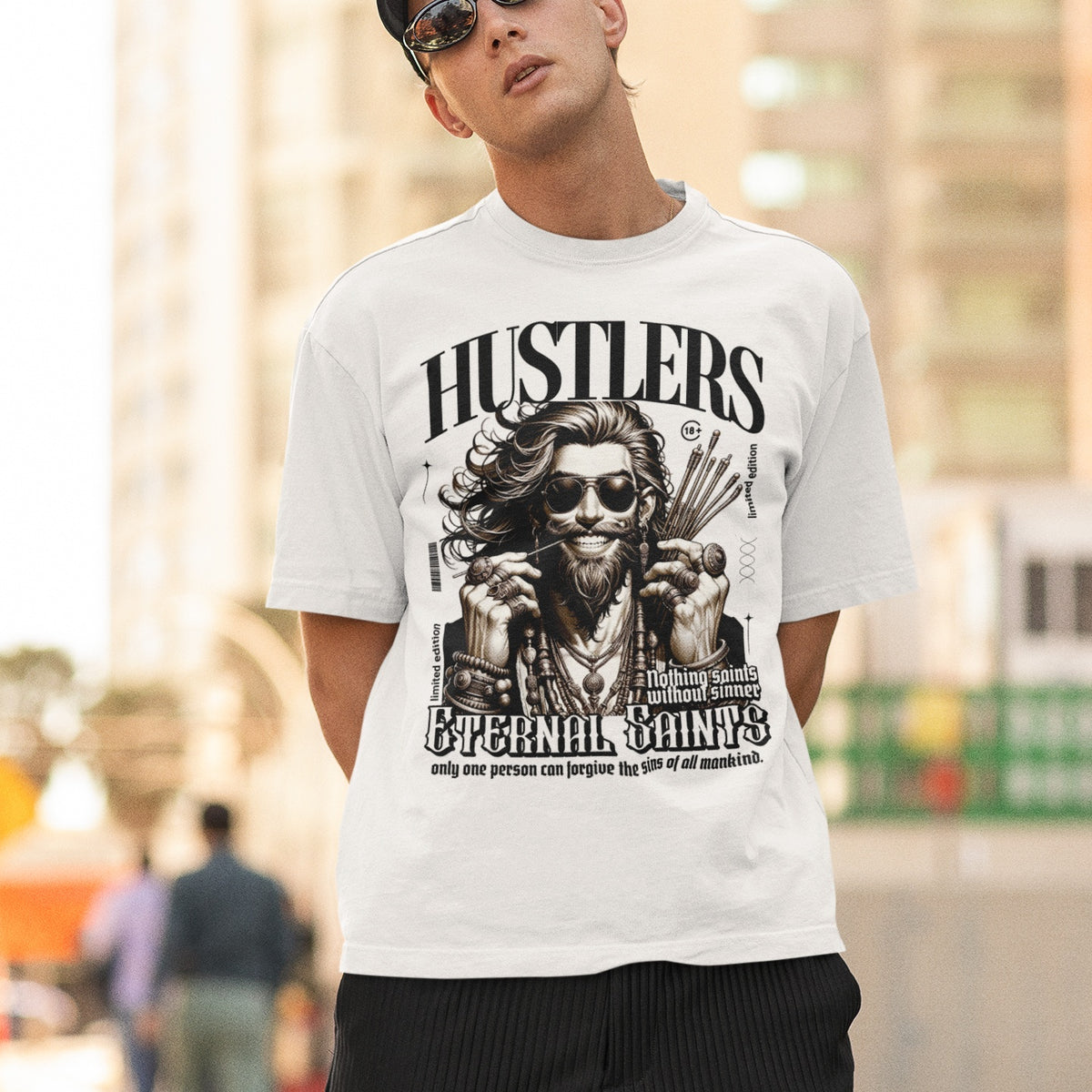 A person wearing a white oversized fit t-shirt with a graphic print in the center.