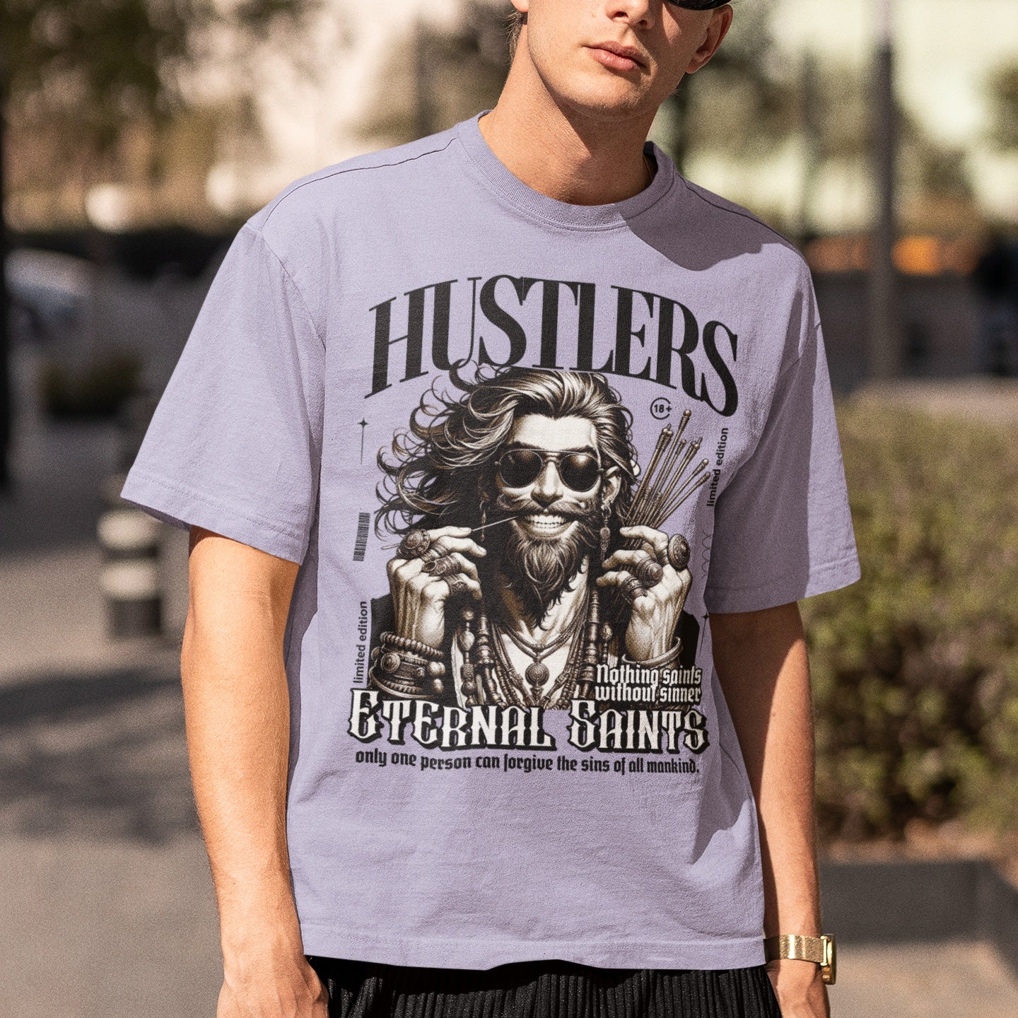 A person wearing a white oversized fit t-shirt with a graphic print in the center.
