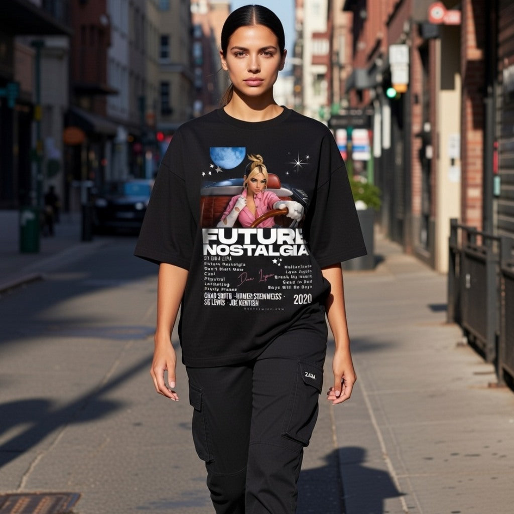Person wearing a black t-shirt with graphic design and text on a city street.