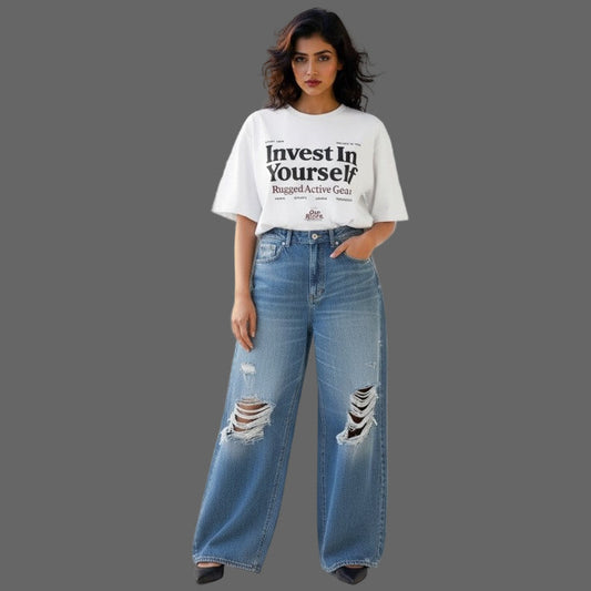 Woman wearing a white t-shirt with text and blue jeans on a white background