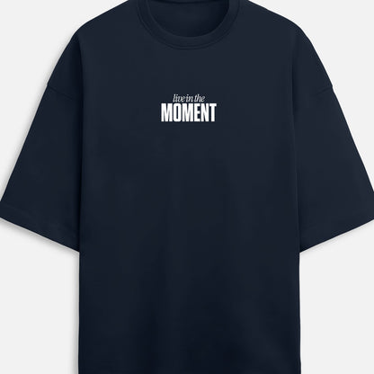 Black t-shirt with 'live in the Moment' text on a white background