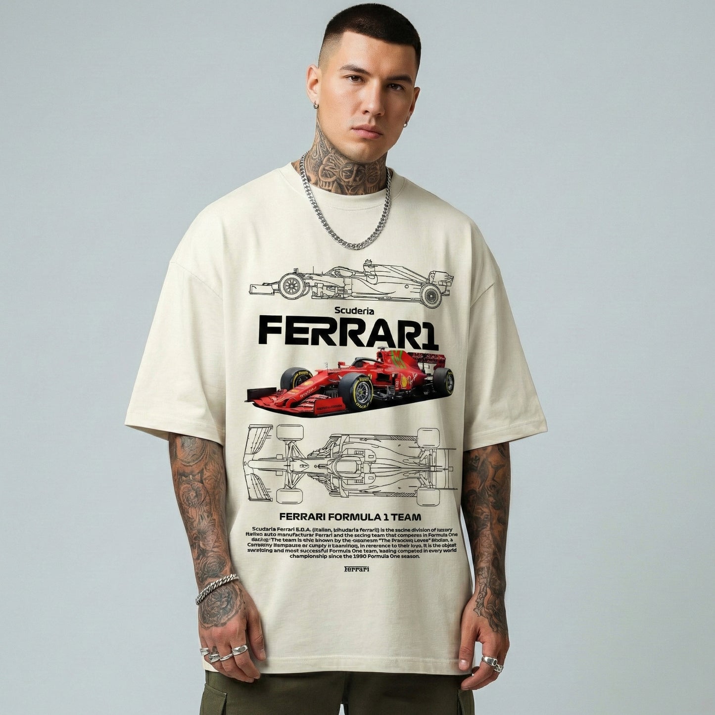 Person wearing a cream t-shirt with Ferrari Formula 1 team design on a gray background