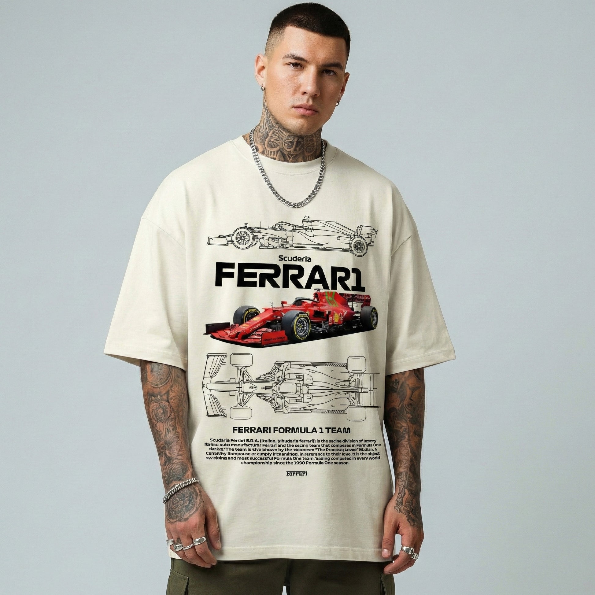 Person wearing a cream t-shirt with Ferrari Formula 1 team design on a gray background