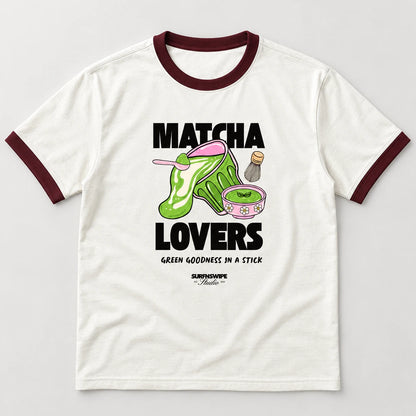 An off-white ringer t-shirt with dark maroon collar and sleeve cuffs, featuring a 'Matcha Lovers' graphic print on the front.