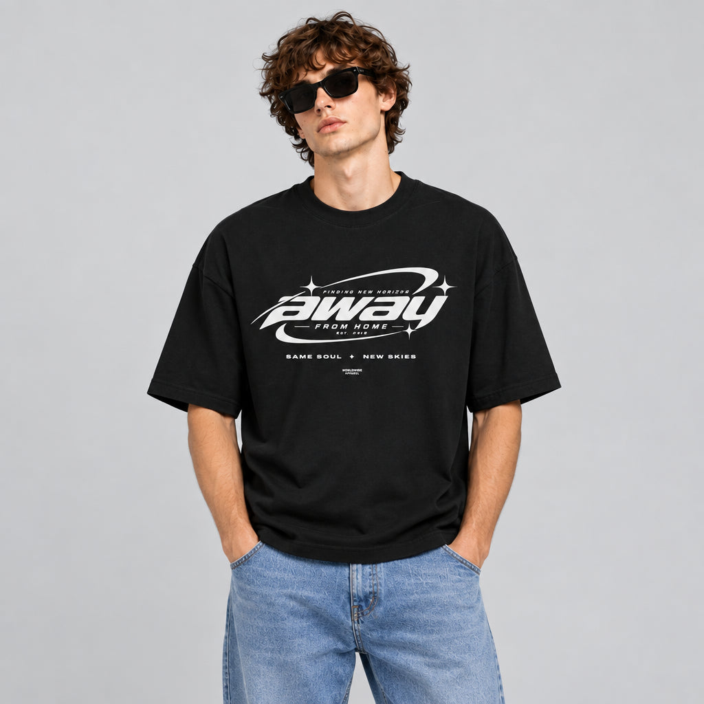 Model wearing the black Away From Home oversized T-shirt