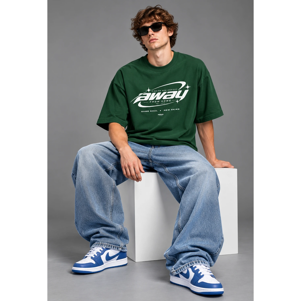 Model wearing the bottle green Away From Home oversized T-shirt
