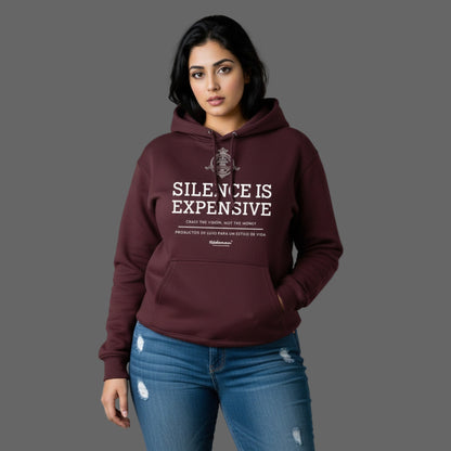 Woman wearing a maroon hoodie with 'Silence is Expensive' text on a gray background
