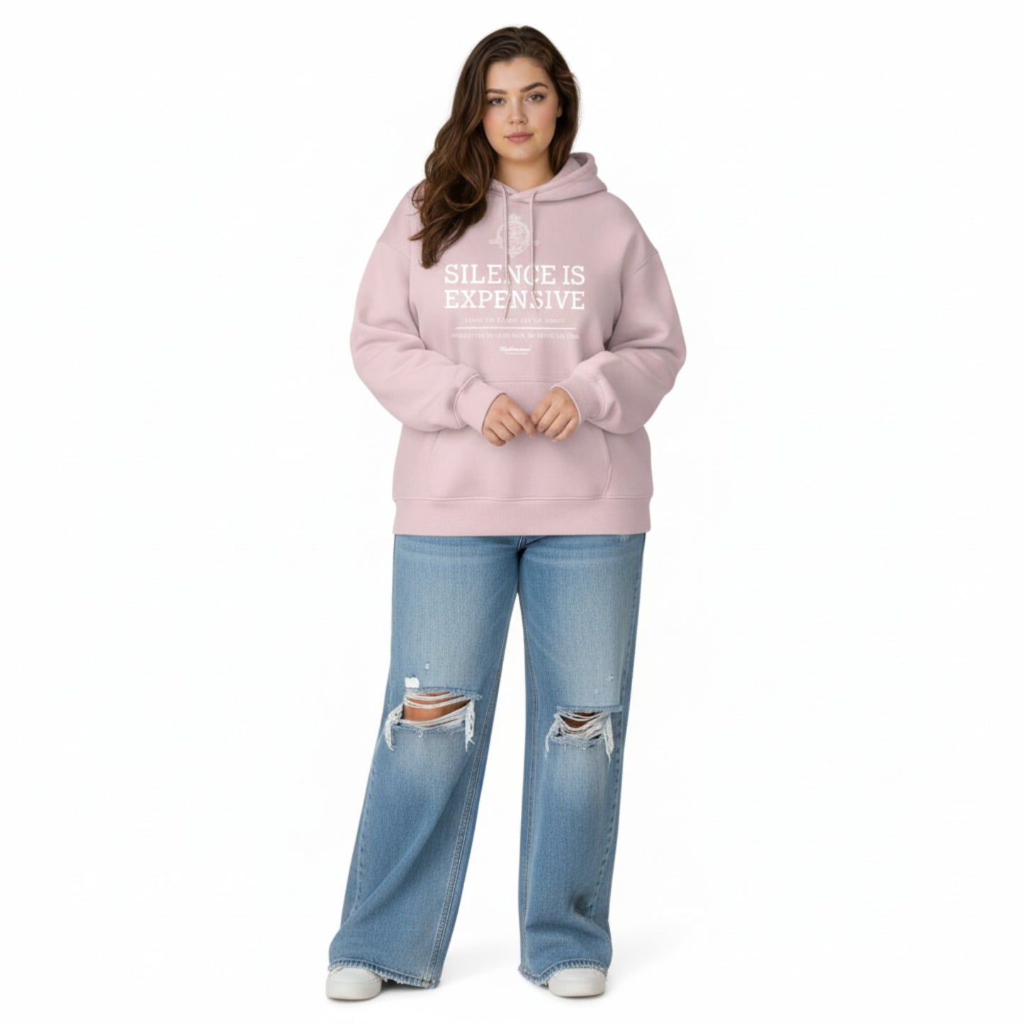 Person wearing a pink hoodie with text and ripped jeans on a white background