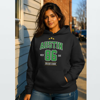 Person wearing a black hoodie with 'Austin 86 West Side College League' text outdoors.