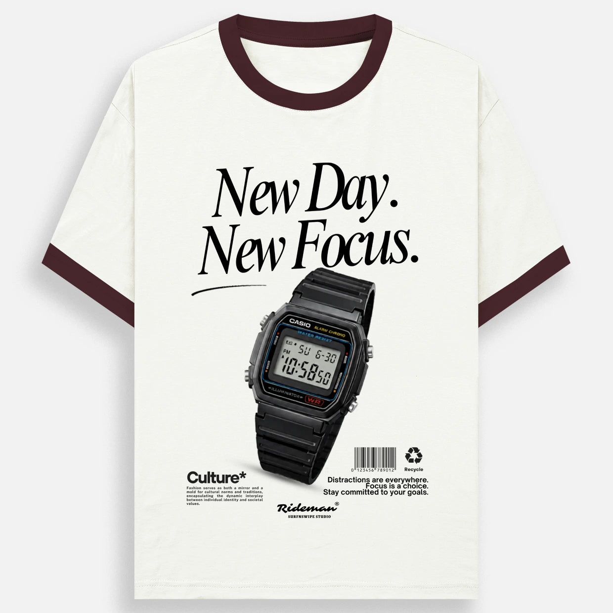 An off-white ringer t-shirt with dark brown trim on the collar and sleeve cuffs, featuring a graphic print of a black Casio watch and the text 'New Day. New Focus.