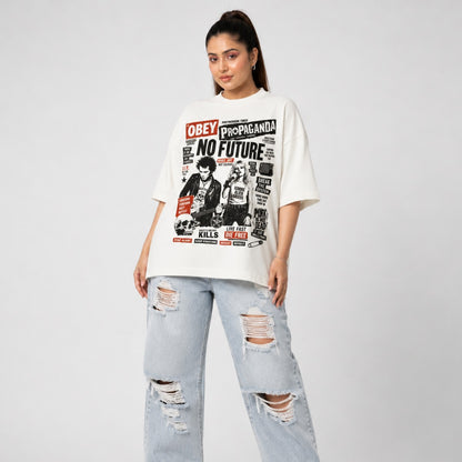 Person wearing a white graphic t-shirt with text and images, paired with light blue ripped jeans on a plain background.