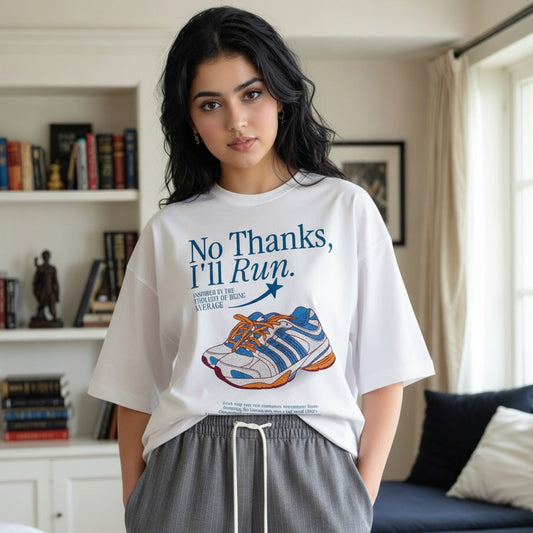 Woman wearing a white t-shirt with a graphic and text in a living room.