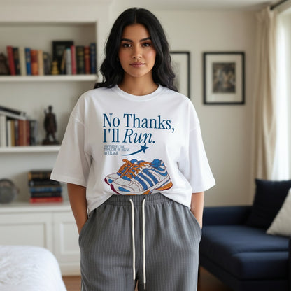 Person wearing a white t-shirt with a graphic and text in a living room.