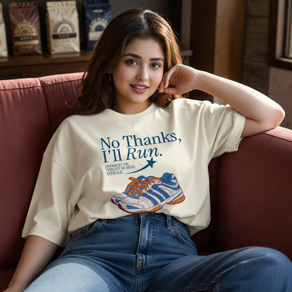 Woman wearing a t-shirt with a graphic and text, sitting on a couch.