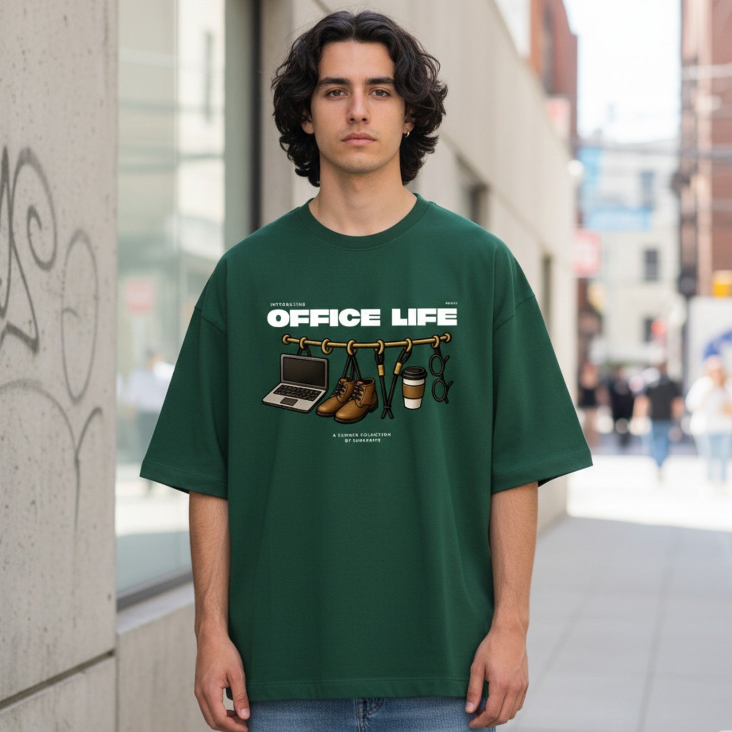 Person wearing a green t-shirt with 'Office Life' graphic design on a city street.