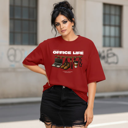 Woman wearing a red t-shirt with 'Office Life' graphic design outdoors.